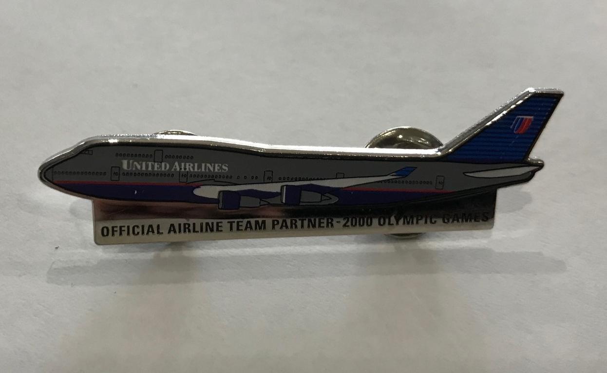 United Airlines - Official Airline Team Partner Sydney 2000 Olympic Games Plane Lapel Pin Badge